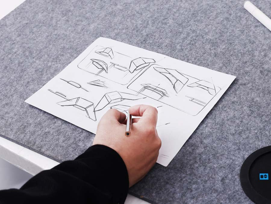 A man is drawing his product design