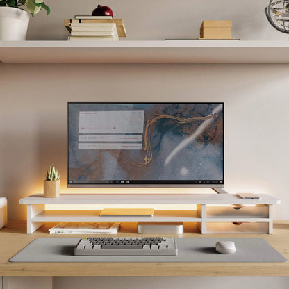 Modern home office setup with a computer monitor, keyboard, and mouse on a desk.